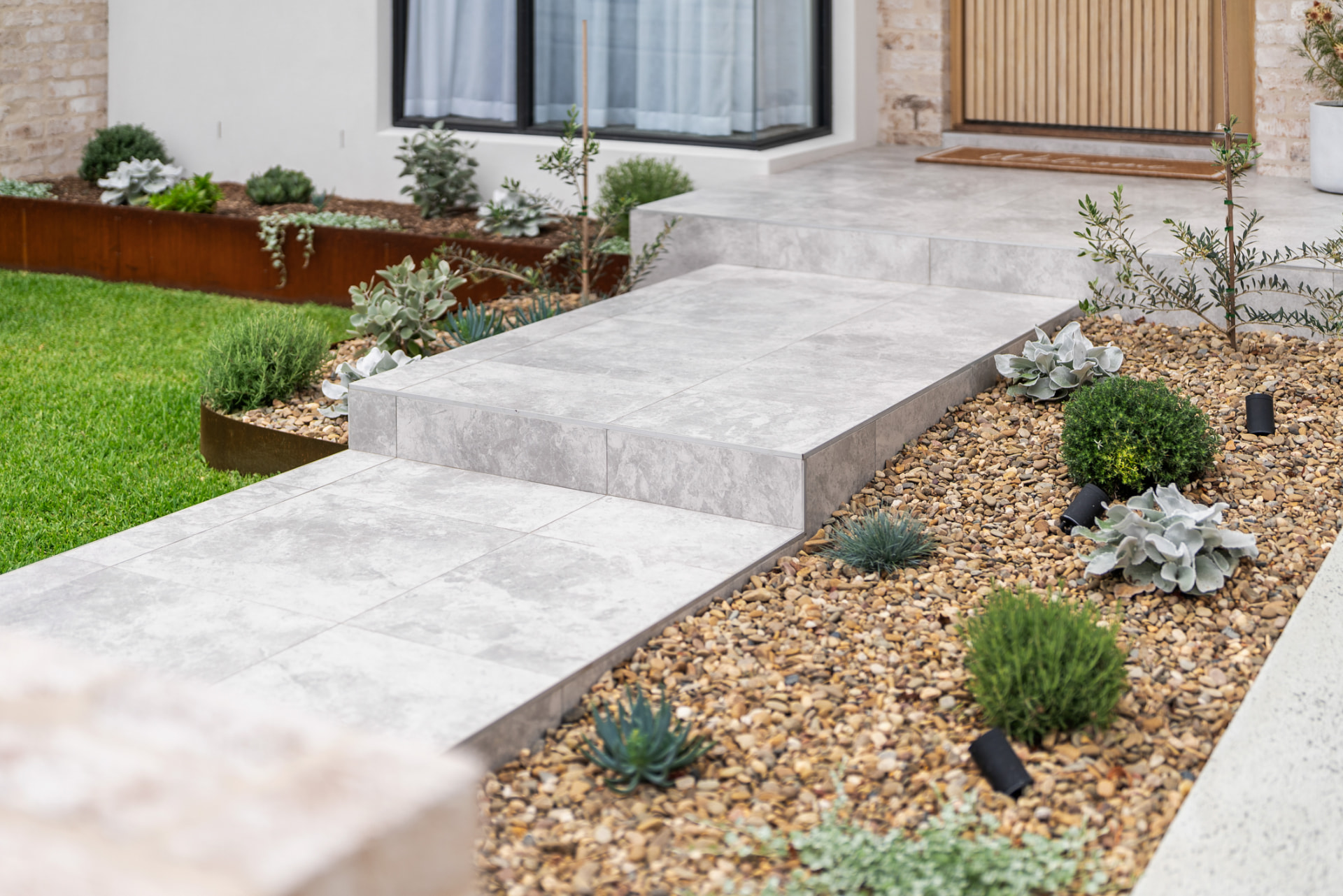 Landscaped stone pathway and garden at a Bayview Homes project