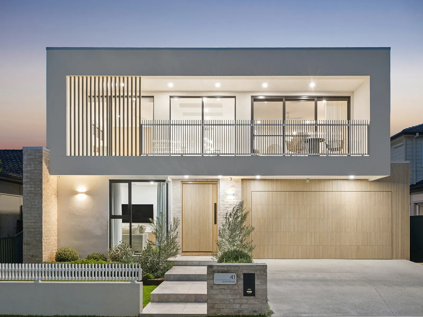 Front facade of the completed Scott custom home in Kogarah at dusk
